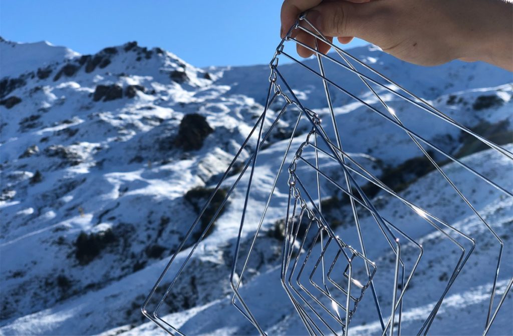 Square Wave Metallic Silver kinetic spinner in the Bernese Alps.